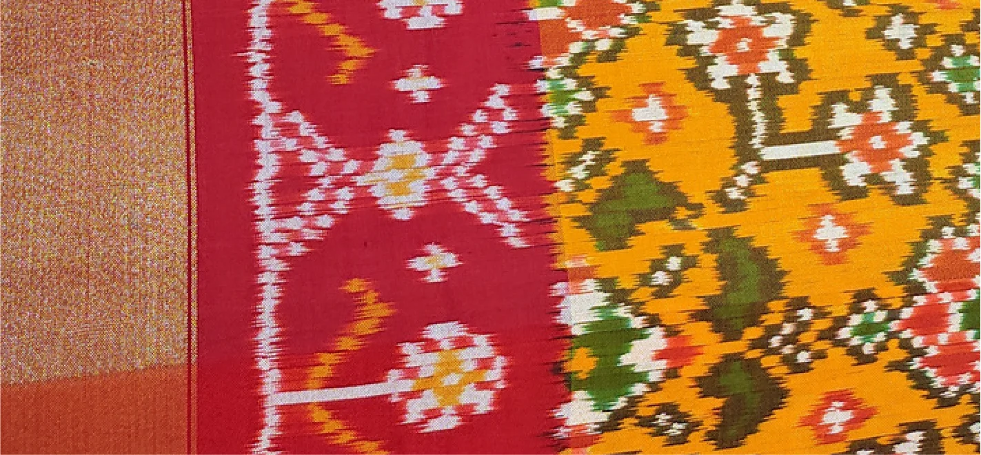 Artisan preparing resist-dyed yarn